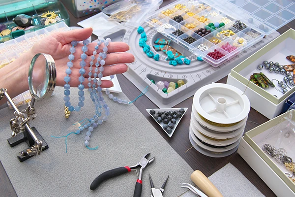 a craftsman making the custom jewelry