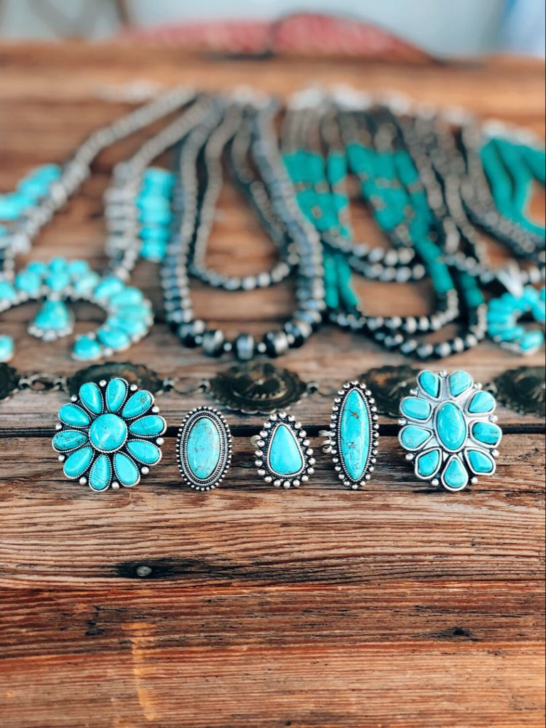turquoise rings and necklaces put on the table